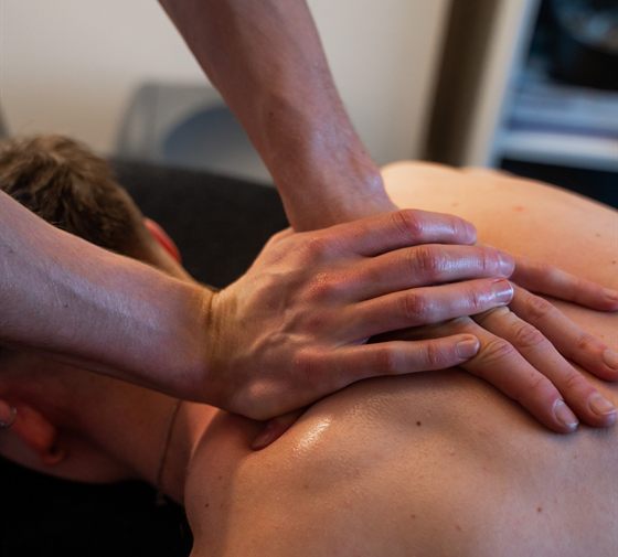 Close-up of hands-on sports massage at The Solution Clinic