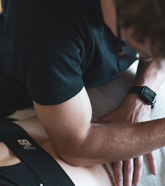 Hands-on soft-tissue treatment during a sports massage