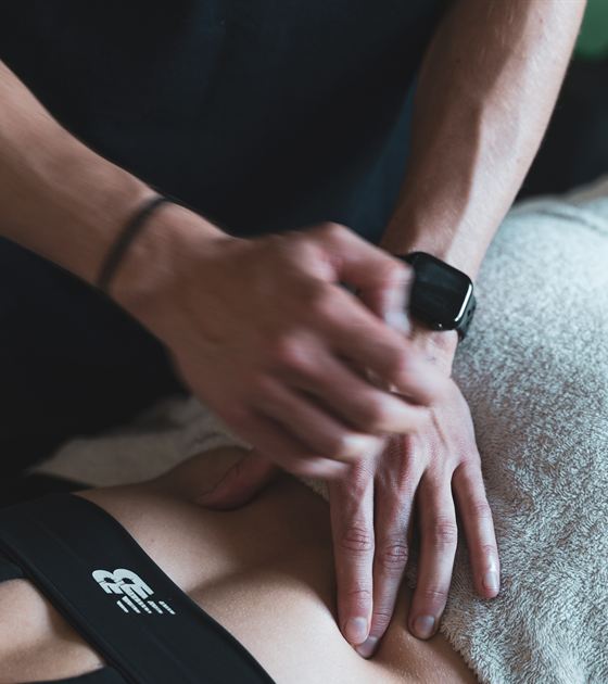 Close-up of hands-on treatment at The Solution Clinic